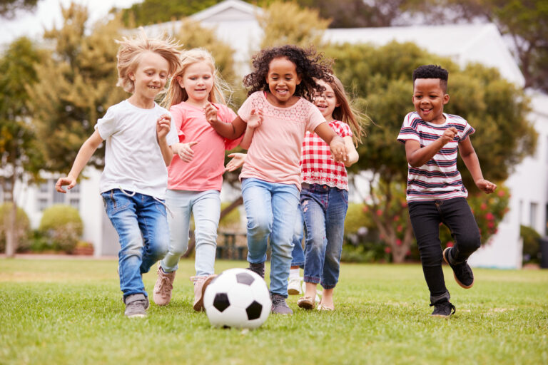 Elementary children playing soccer