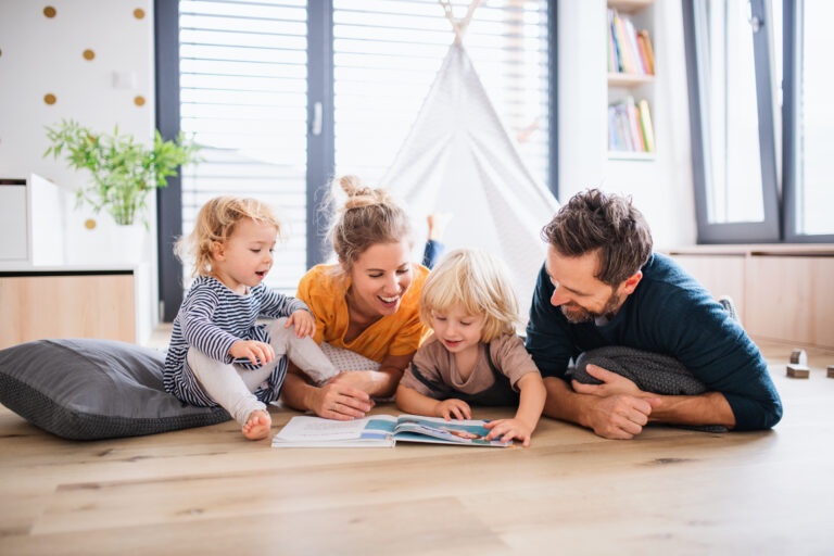 Family reading on the floor together