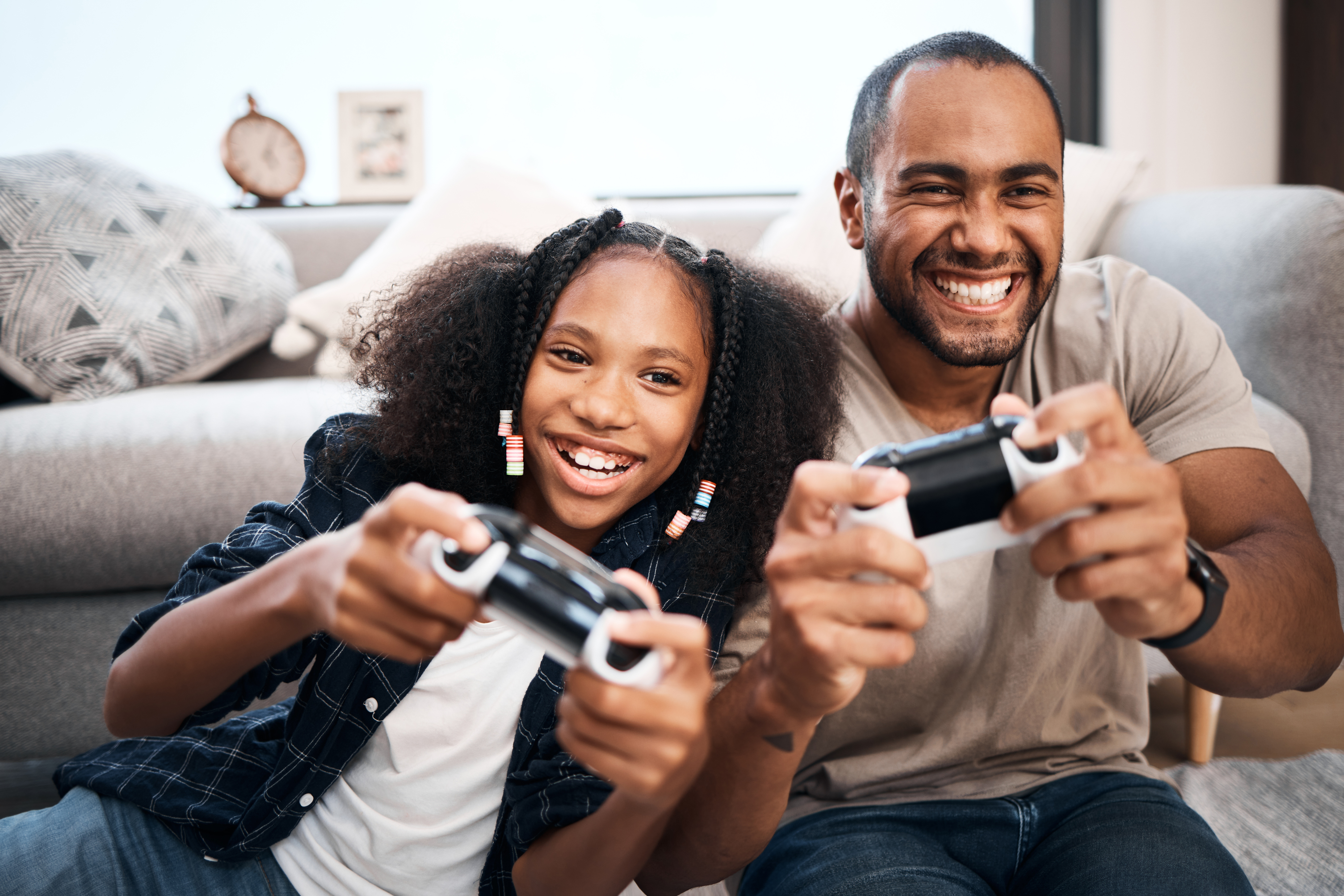 Teen and dad playing video games