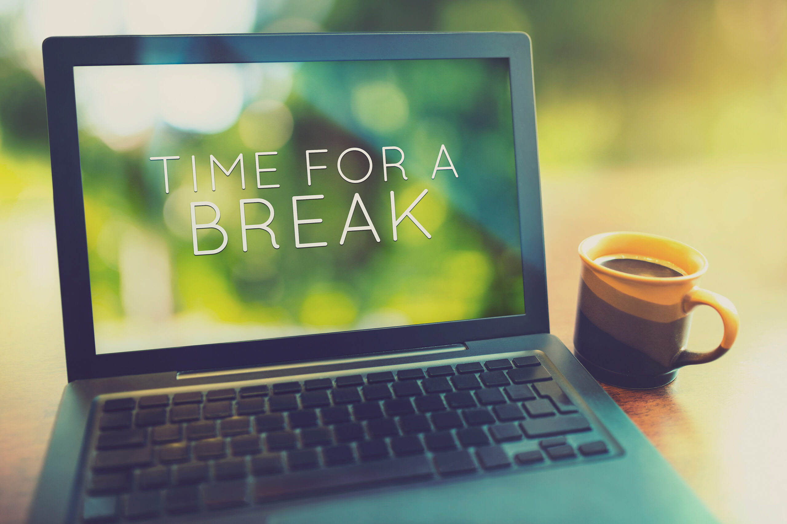 Computer with the words "time for a break" on it