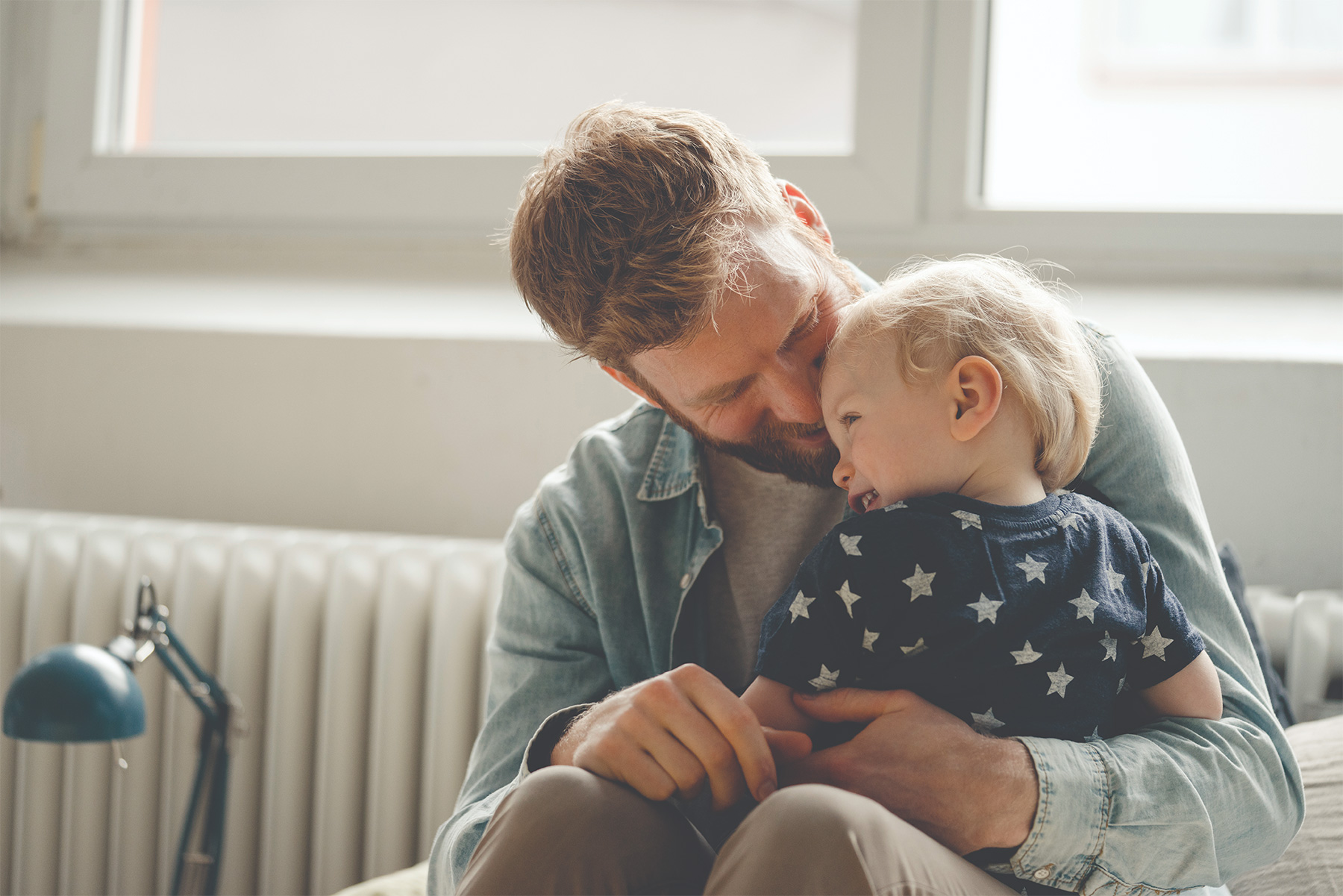 Father spending time with his son at home