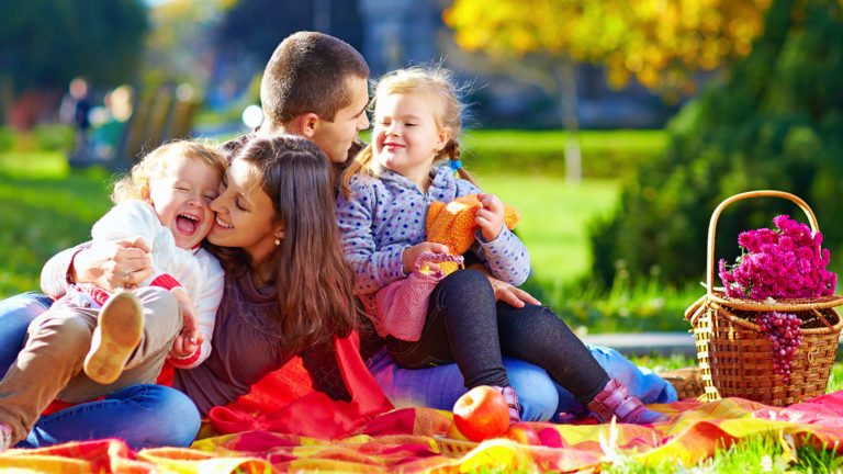 family enjoying the autumn outdoors together