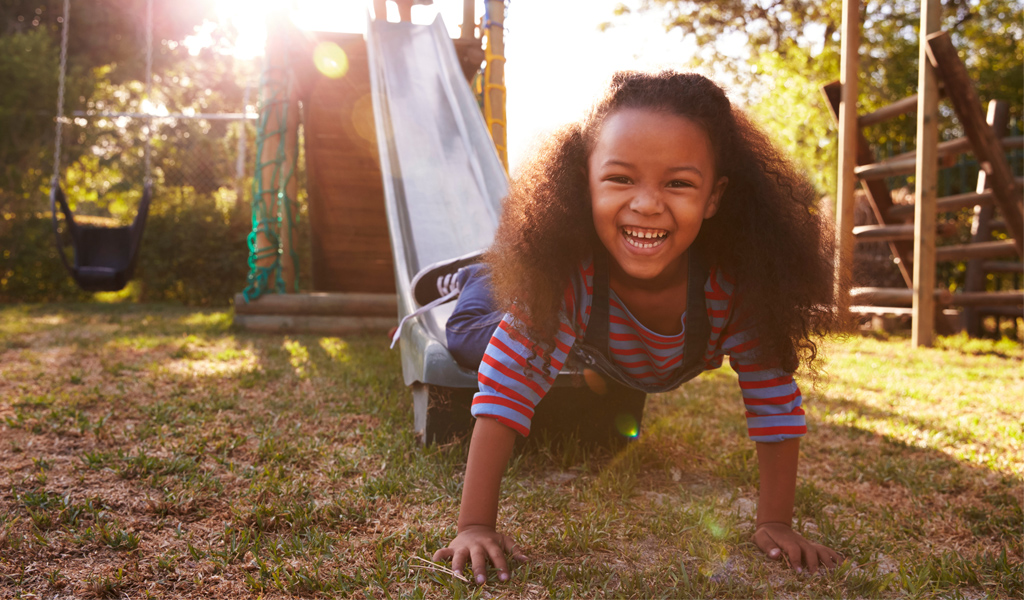 girl outside on a slide