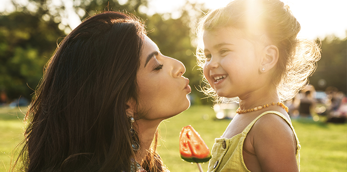 mom kissing toddler