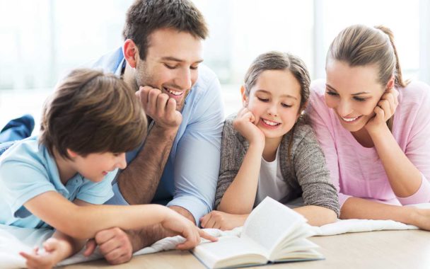 Family reading a book together