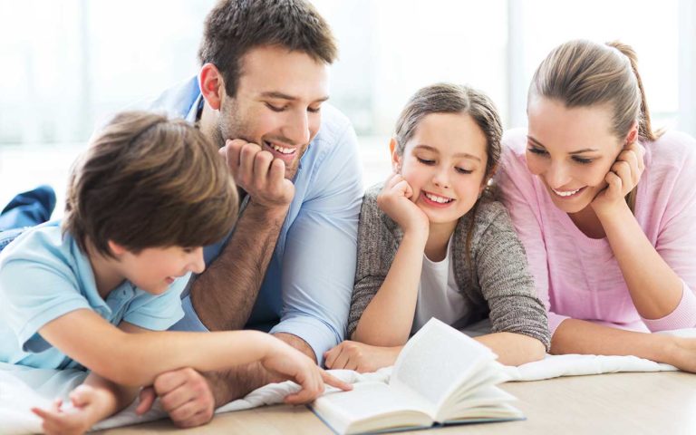 Family reading a book together